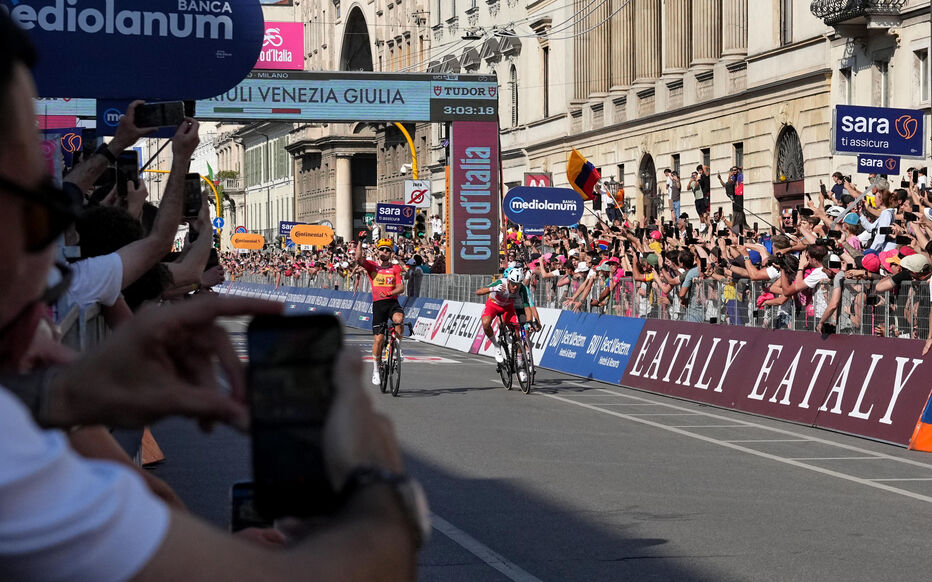 Giro d'Italia bans Enrico Zanoncello for helmet strike on rival.